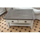 A matching double sided painted pine coffee table with four drawers, 102 x 65 x 51cm.