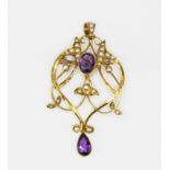 An Edwardian 9ct yellow gold (stamped 9ct) brooch / pendant set with amethysts and split pearls,