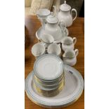 A Royal Doulton 'Berkshire' pattern tea service with serving dishes and extra plates.