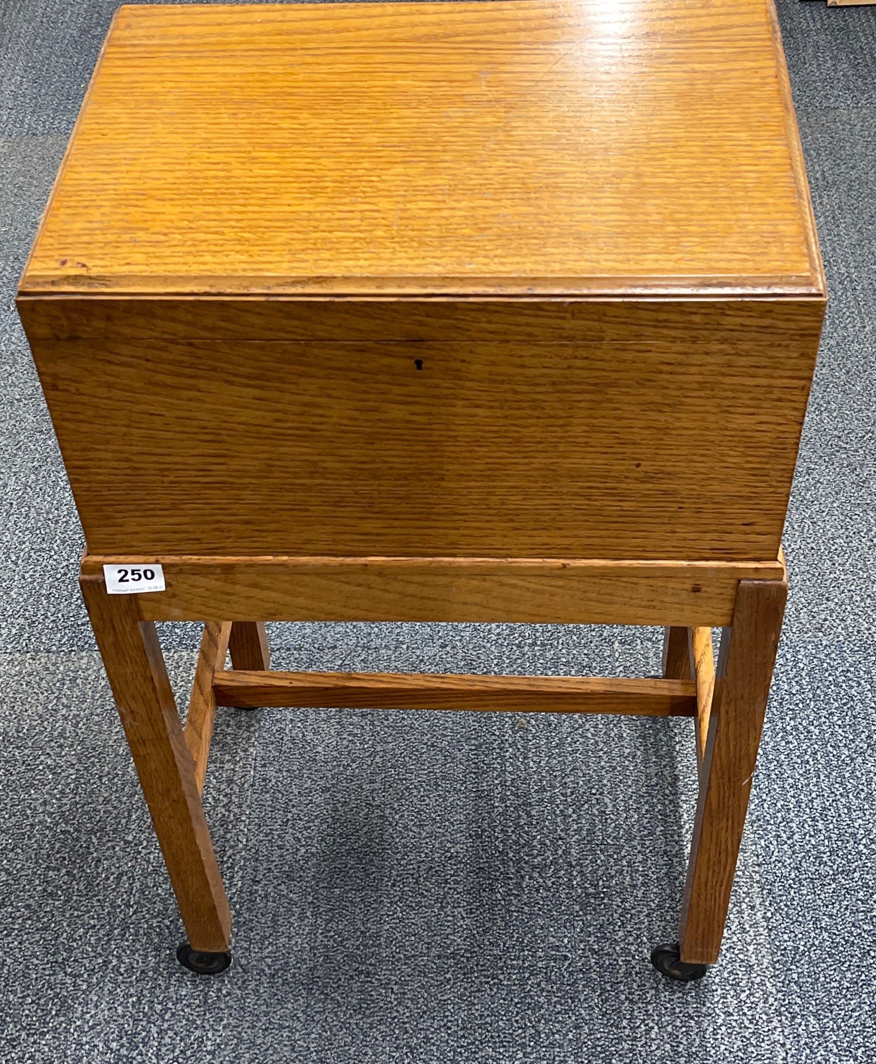 A 1930's light oak work box, 45 x 31 x 80cm.