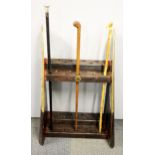 An interesting wood and brass RAF aircraft propeller walking stick stand together with three sticks,