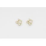 A pair of 14ct yellow gold (stamped 14K) musical note shaped stud earrings set with brilliant cut
