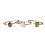 Three 925 silver stacking rings, set with peridot, garnet and opal, (M).