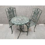 A cast aluminium garden table and two chairs, table W. 61cm. H. 66cm.