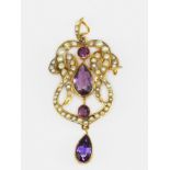An Edwardian 9ct yellow gold (stamped 9ct) brooch / pendant set with amethysts and split pearls,
