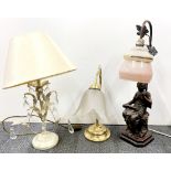A figural table lamp and two others.