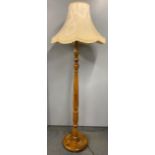 A 1930's turned wooden standard lamp, H. with shade 177cm.