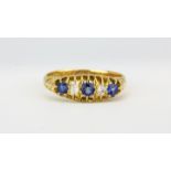 An Edwardian 18ct yellow gold ring set with sapphires and diamonds, (M.5).