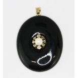 A Victorian yellow metal (tested minimum 9ct gold) onyx mourning locket set with a pearl and rose