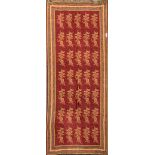 An Indian fine wool burgundy ground shawl, 200 x 70cm