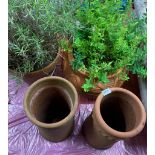 Two terracotta chimney pot style planters by Yorkshire flower pots, H. 41cm. Together with two