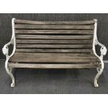 A cast iron and wooden garden bench, L. 125cm. H. 82cm.