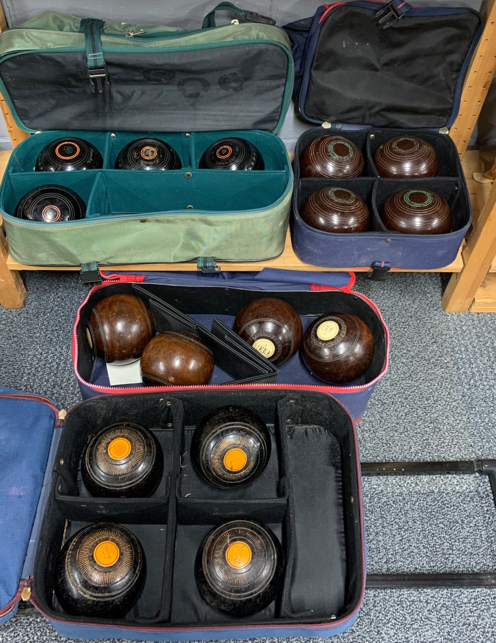 Four sets of lawn bowls.