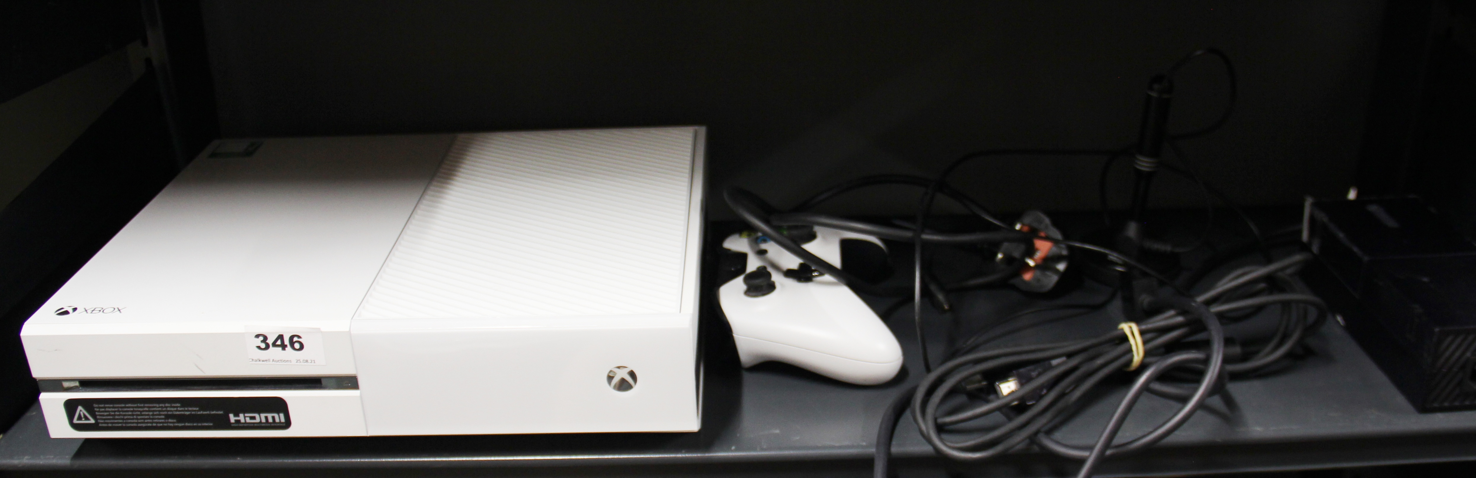 A white Xbox one, model 1450, with one controller.