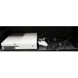 A white Xbox one, model 1450, with one controller.