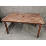 A teak garden table, 150 x 90cm.