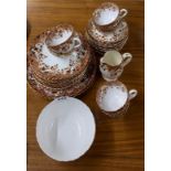 A Victorian part tea service, 6 cups, 10 saucers, 11 side plates, sandwich plates, sugar bowl and