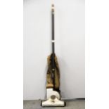 An early push action vacuum cleaner with friction generated suction.