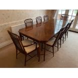 A superb Chinese Chippendale style dining table and eight cane backed chairs including two