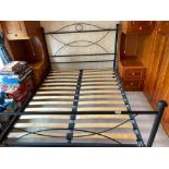 A contemporary metal framed double bed with wooden slatted base, W. 145cm. L. 197cm.