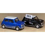 Two die cast friction driven Minis, L. 13cm.