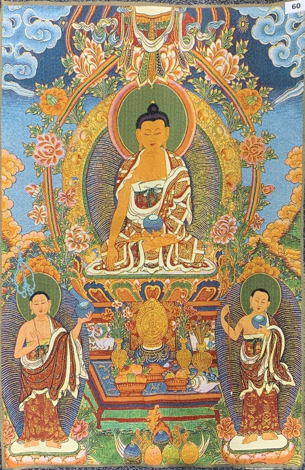 A Tibetan woven Buddhist thangka of the seated Buddha incorporating gold thread, 89 x 60cm.