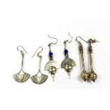 Three pairs of 925 silver and white metal earrings.