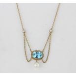 An antique hallmarked 9ct yellow gold necklace set with an oval cut blue topaz and pearls, approx.