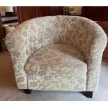 An upholstered tub chair, W. 84cm.