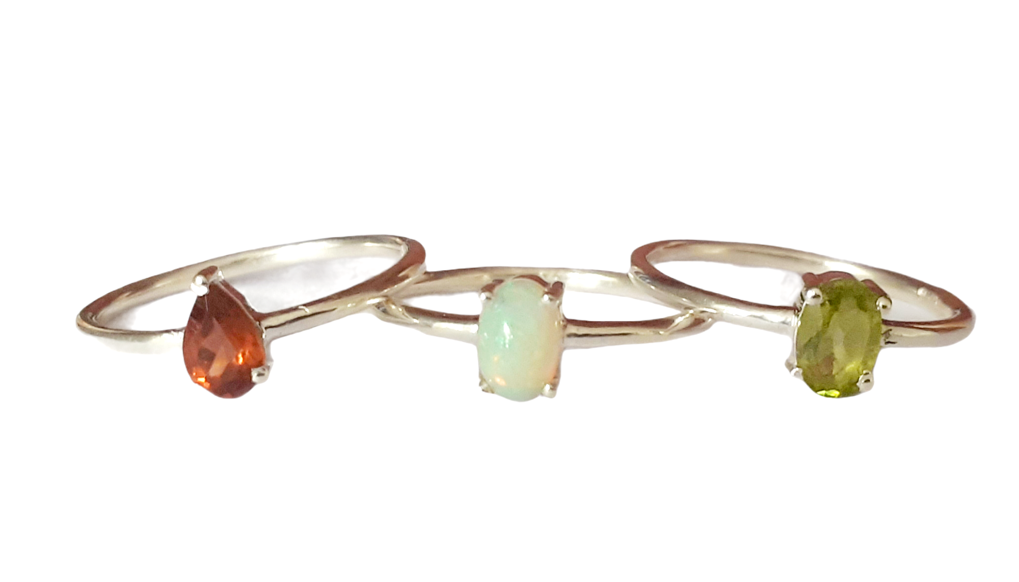 Three 925 silver stacking rings, set with peridot, garnet and opal, (M).