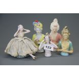 A group of five porcelain and 'chalk' half dolls, tallest 14cm.