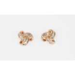 A pair of 9ct rose gold stud earrings set with baguette cut diamonds, L. 1cm.