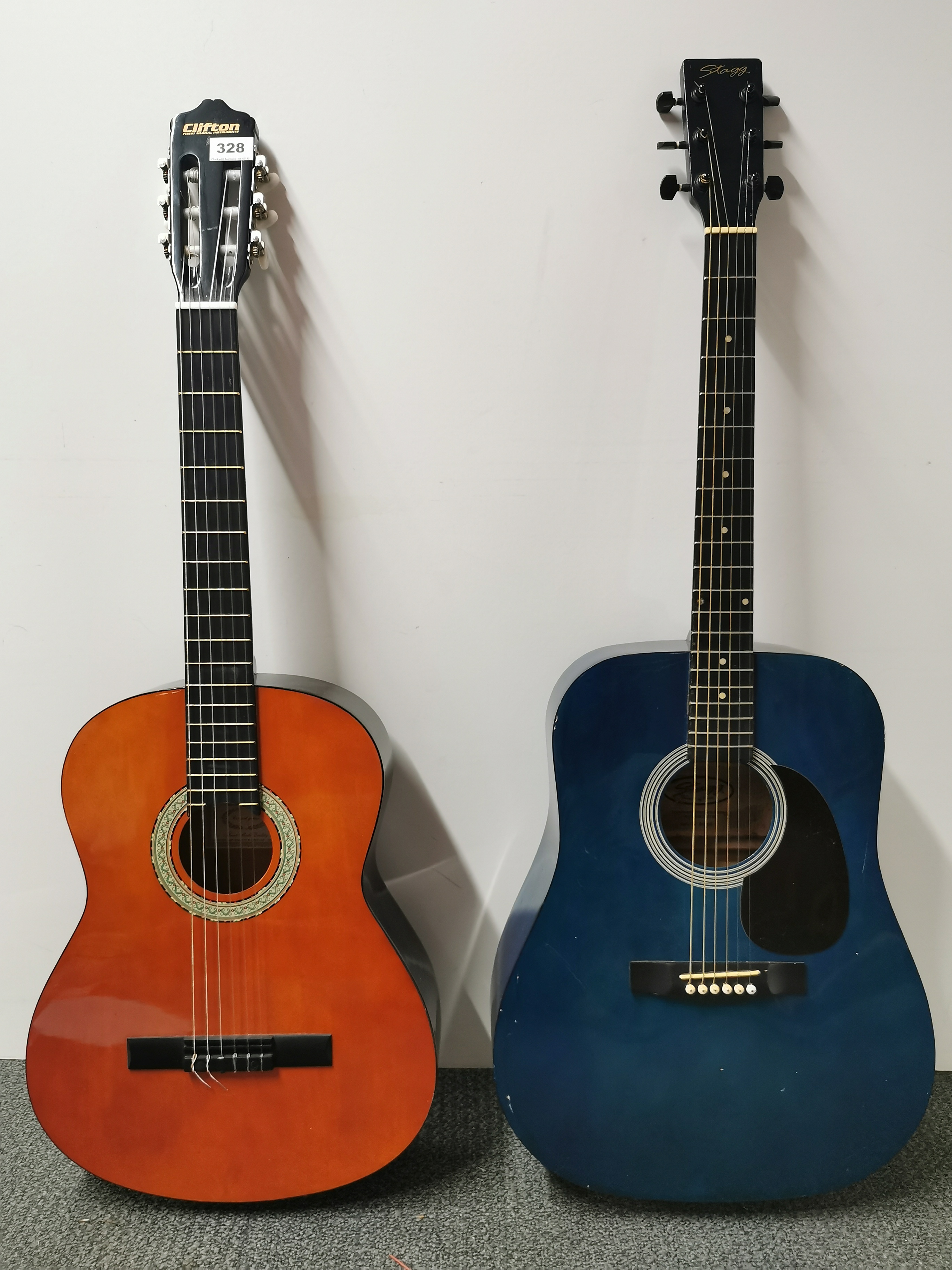 A Stagg handmade Western guitar and a Clifton handmade classical guitar.