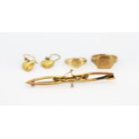 An assortment of 9ct yellow gold jewellery including heart shaped drop earrings, two signet rings