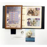 An album of Lord Nelson commemorative stamps and coins together with further proof coins.