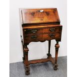 A small Queen Anne style walnut veneered bureau, currently locked closed, 51 x 92cm.