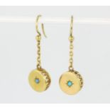 A pair of yellow metal (tested minimum 9ct gold) drop earrings set with turquoise, L. 2.6cm.