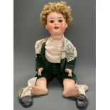 A large Heubach-Kopplesdorf porcelain doll with composition body, trembling tongue and blinking