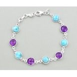 A 925 silver bracelet set with amethyst and cabochon cut larimar, L. 20cm.