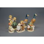 A group of Hummell figures with two Beswick ducks, duck H. 18cm.
