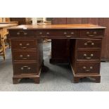 A leather topped mahogany desk, 125 x 63 x 76cm.