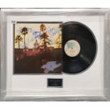 A signed and framed Eagles record 'Hotel California' with certificate of authenticity on back, frame