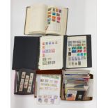 A quantity of stamp albums and loose stamps.