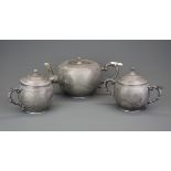 A 19th/early 20th C Chinese hammered and engraved Swatow pewter tea set, H. 13cm.