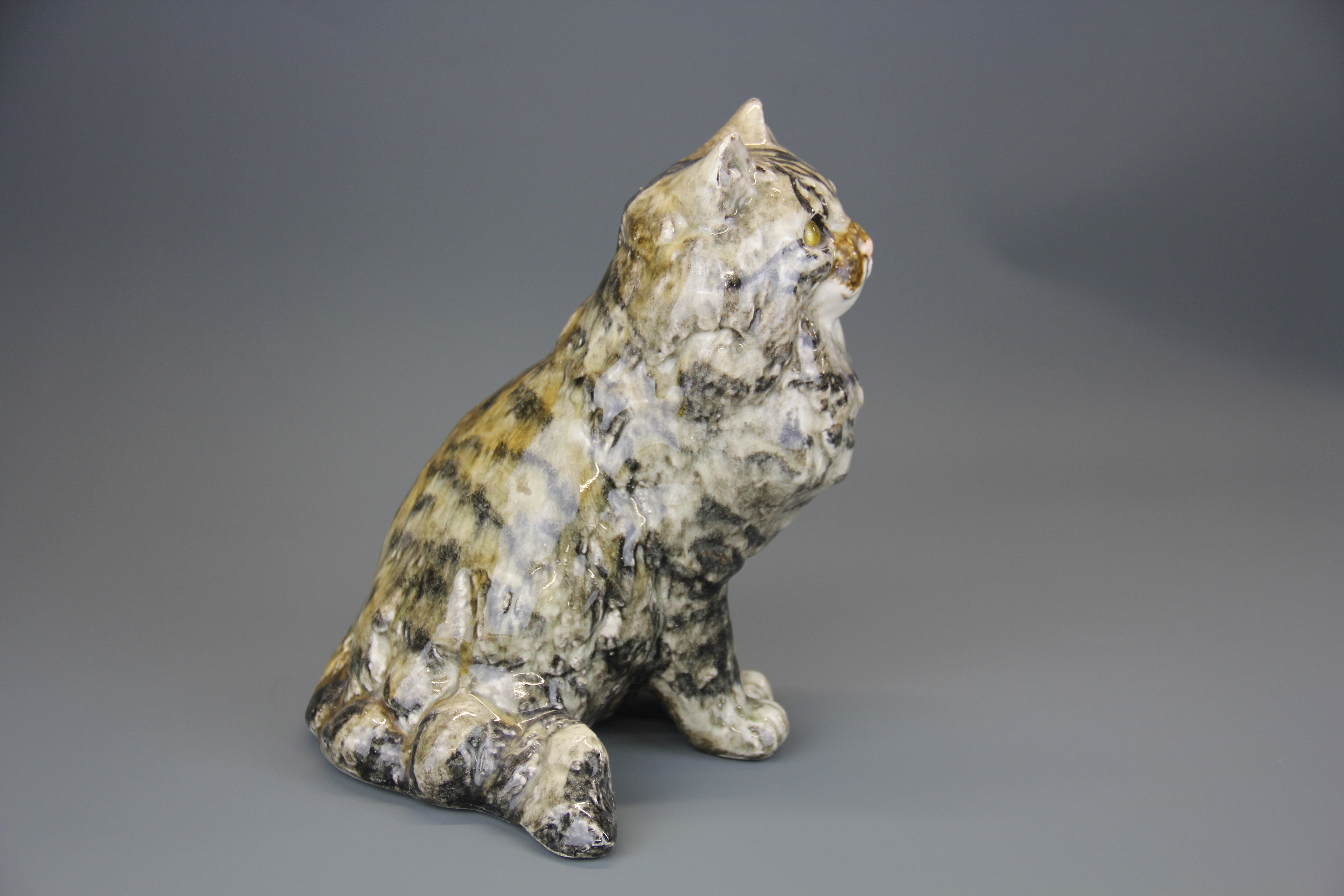 A Winstanley ceramic cat figure with glass eyes, H. 24cm. - Image 2 of 3