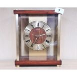 A 1970's Seiko gilt brass and teak mantle clock, H. 25cm. Currently in working order.