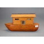 An interesting vintage hand made wooden model of Noah's Ark, L. 46cm. H. 24cm.