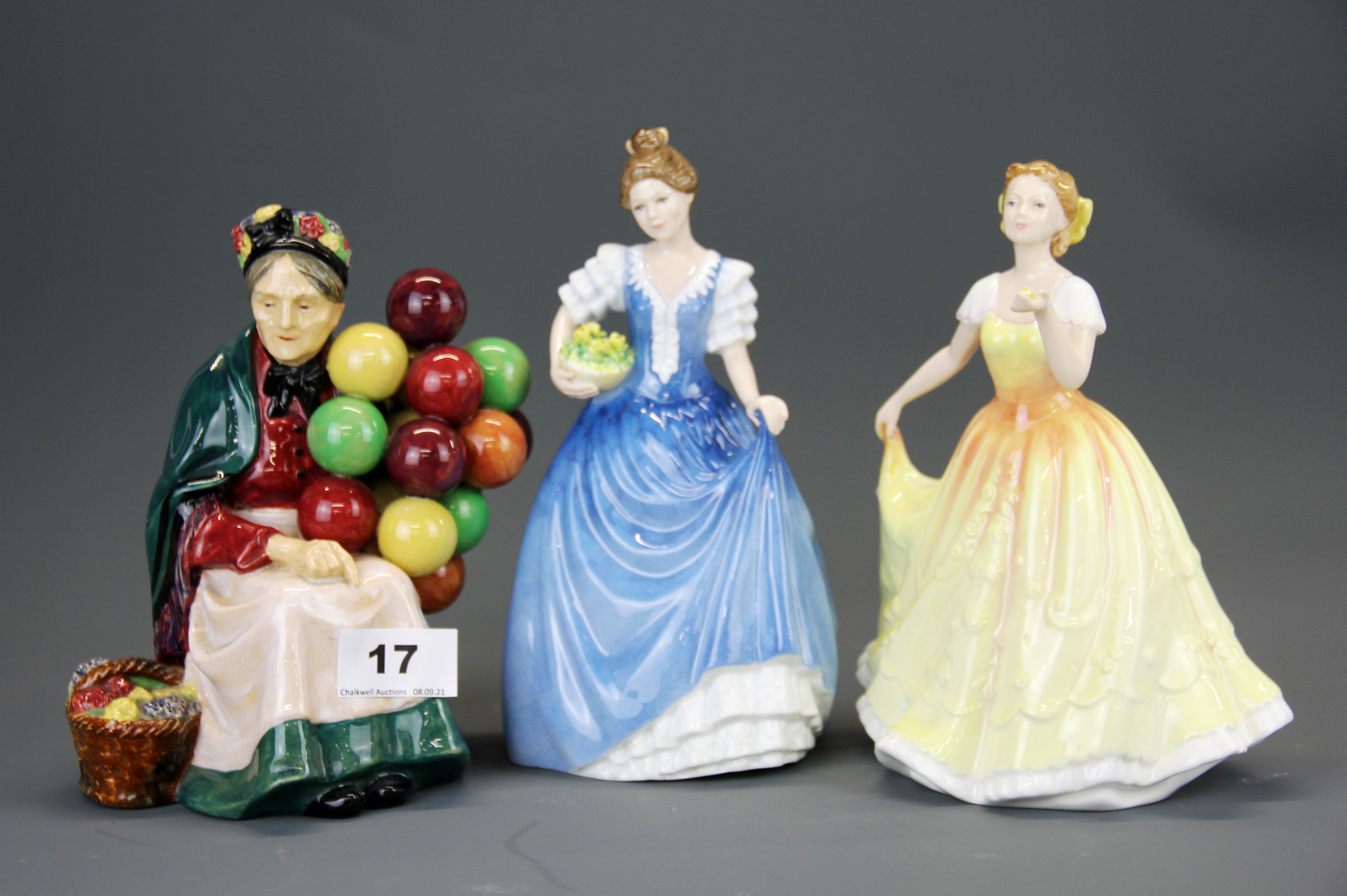 An early Royal Doulton figure of 'The Old Balloon Seller' 'HN1315' together with two further Royal