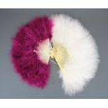 Two 1920's/30's celluloid and ostrich feather fans, largest 30cm.