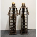 Two unusual carved wooden tribal style racks, H. 86cm.